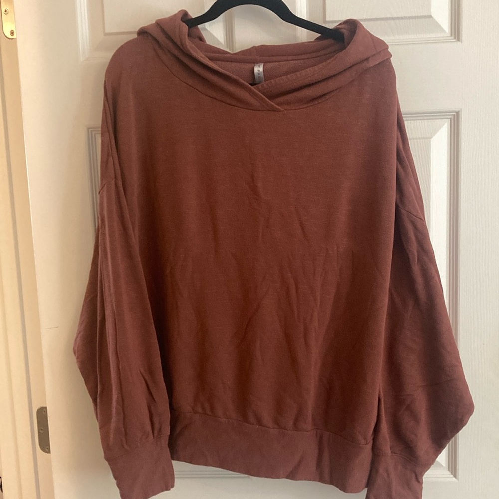 1x rust colored hoodie by Fabletics.